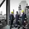 Three engineers at an oil refinery