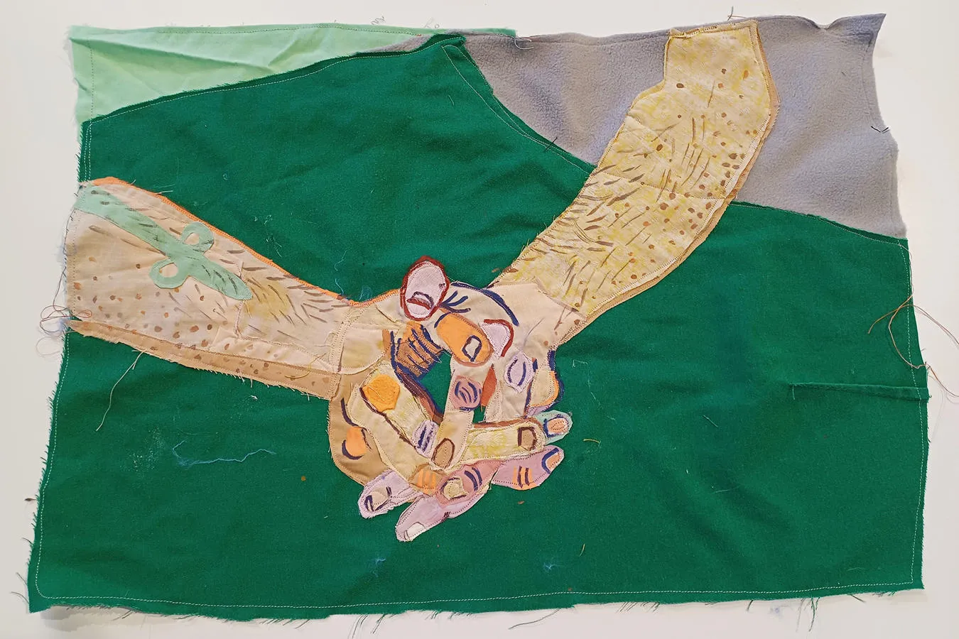 The hands of one of the writing group, created in textiles by artist Ella Dorton