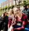 Four students laughing together on University of Hull campus.