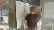 Two people in discussion in front of a map