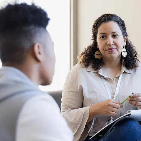Middle aged female counsellor with younger client