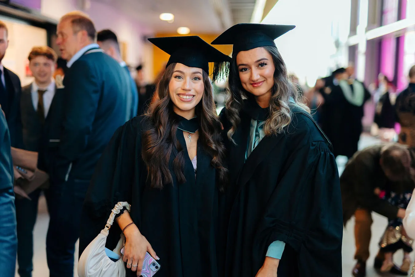 Two female students posing for the camera at Graduation