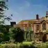 Students walk past the front of one of the University's grade 2 listed buildings