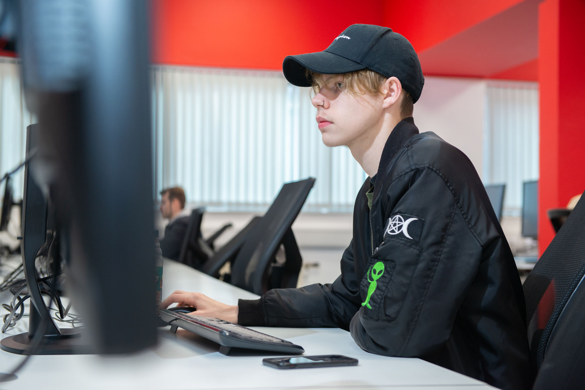 Design student using computer in the design suite