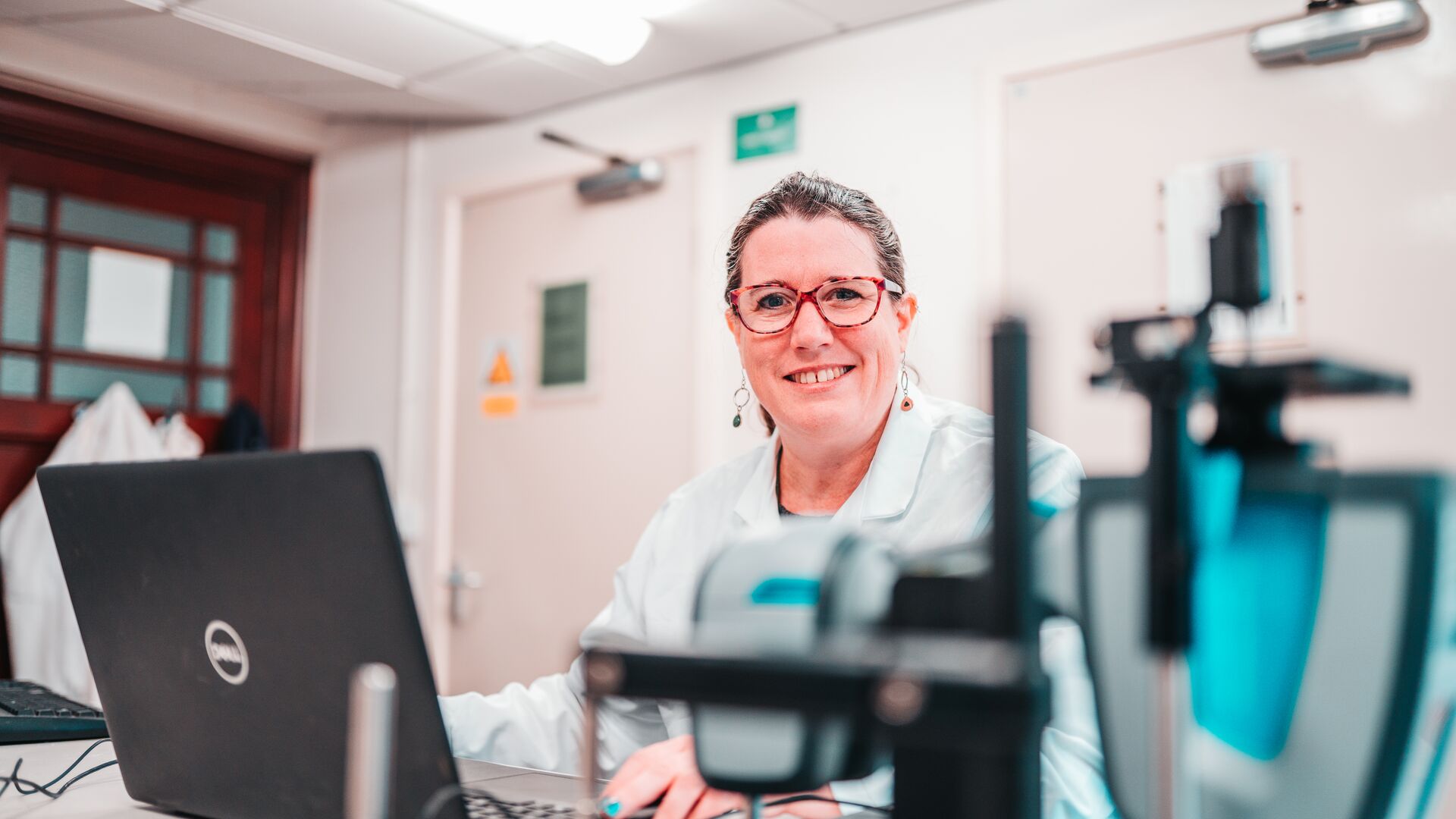 A researcher sat with a laptop in the lab