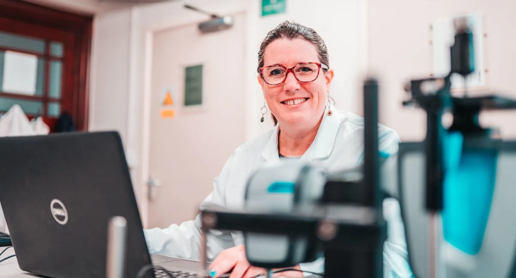 A researcher sat with a laptop in the lab