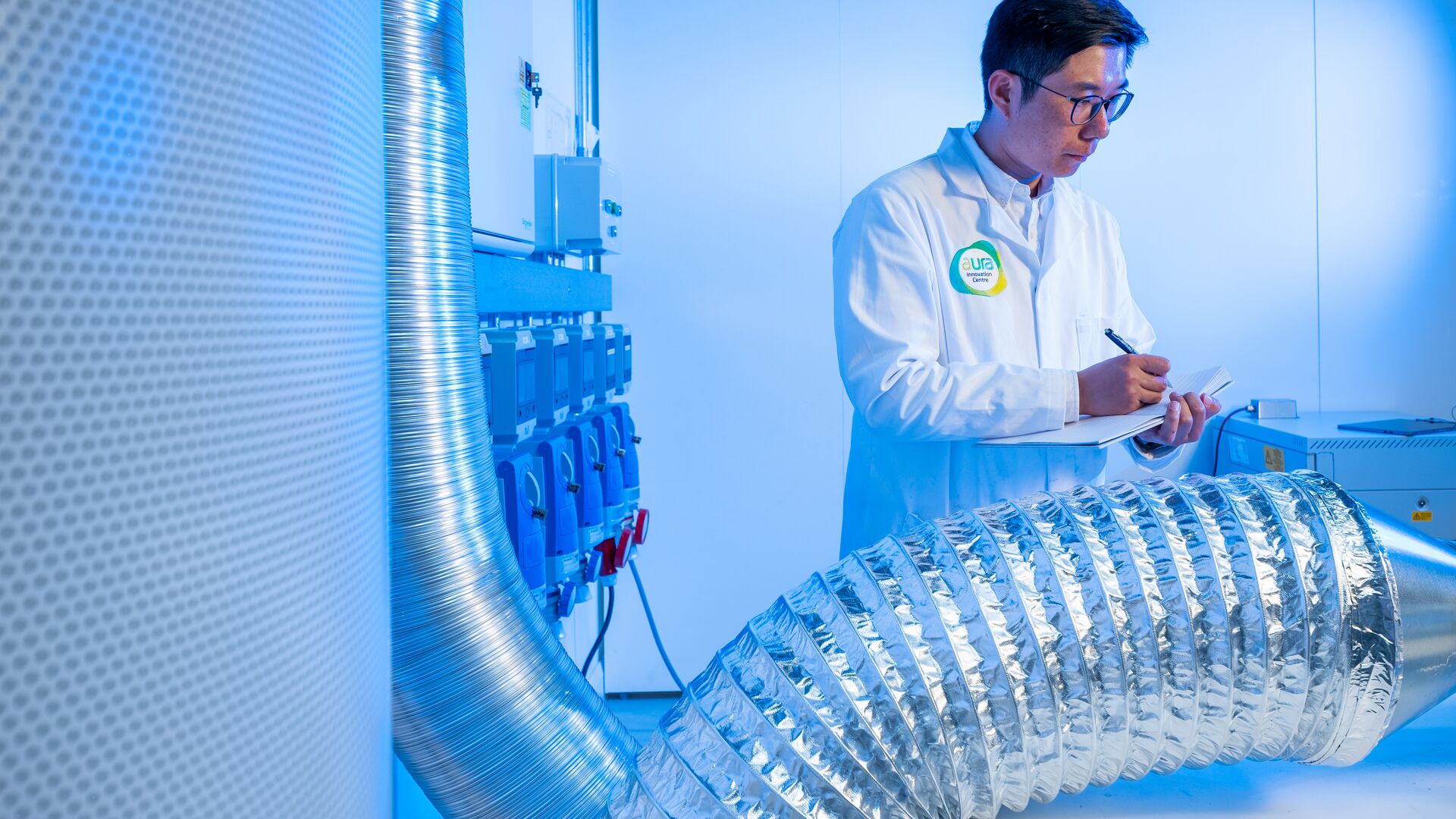 Researcher in a lab coat doing an experiment