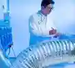 Researcher in a lab coat doing an experiment