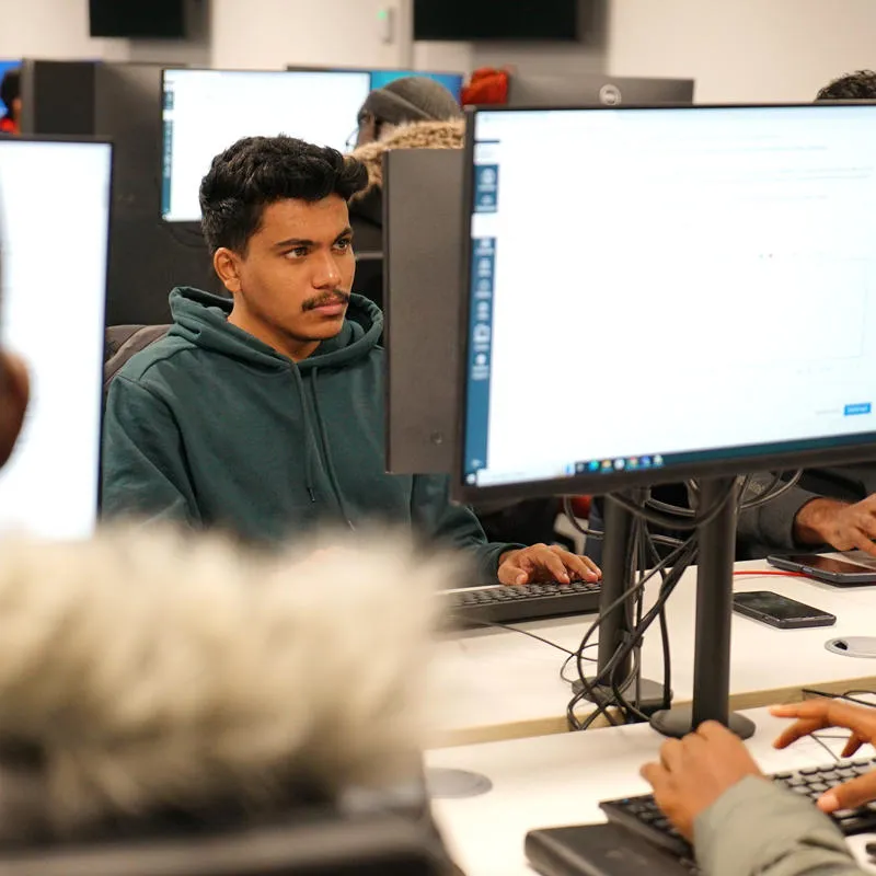 Students working on computers in DAIM