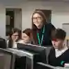 Teacher interacting with students using ICT equipment at Kelvin School