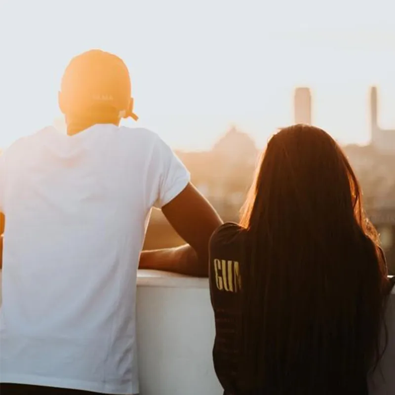 Teenagers looking at sunset