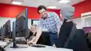 teacher helping student