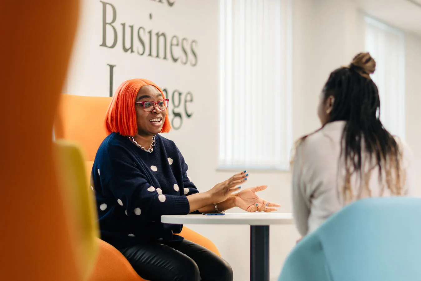 Students talk in the Business lounge on campus