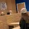 Mock courtroom trial with interaction between judge and barrister