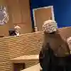 Mock courtroom trial with interaction between judge and barrister