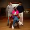 Three students in a museum