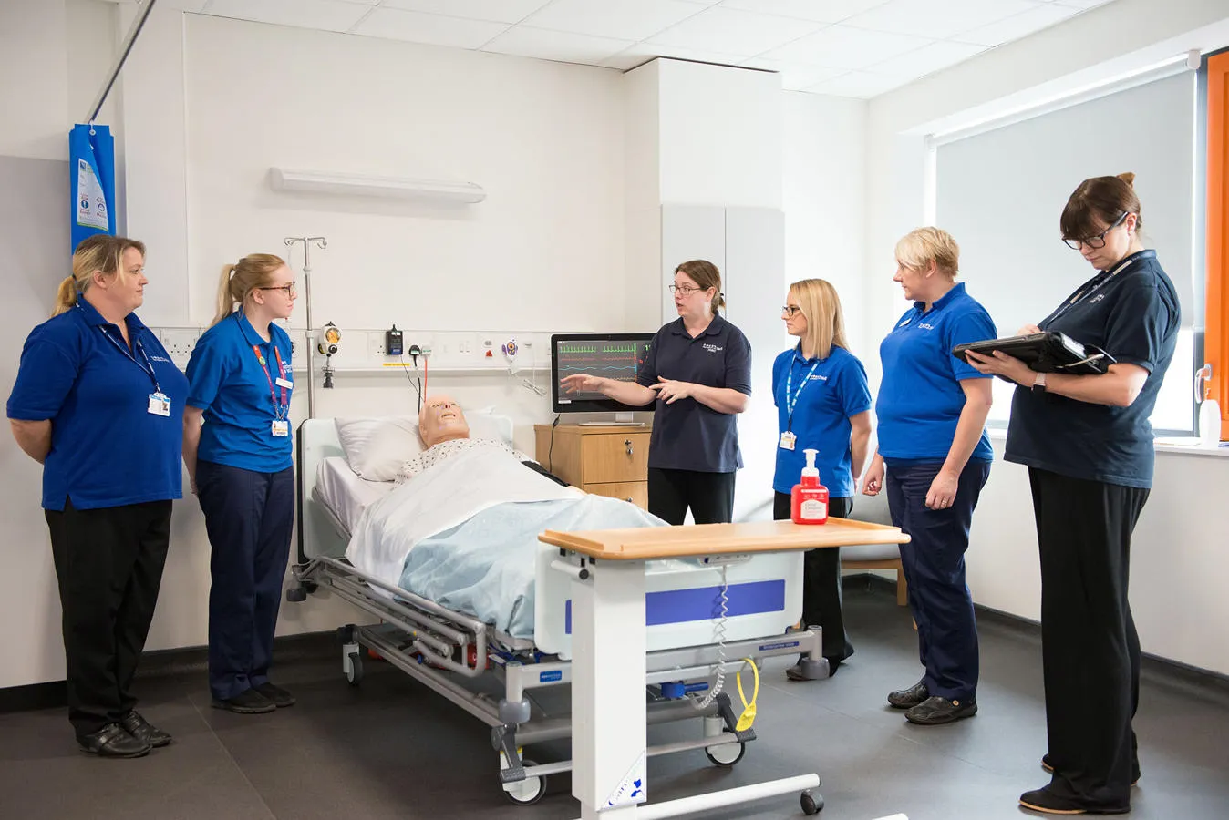 A practical session using a mannequin in a simulated hospital ward