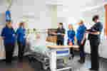 A practical session using a mannequin in a simulated hospital ward