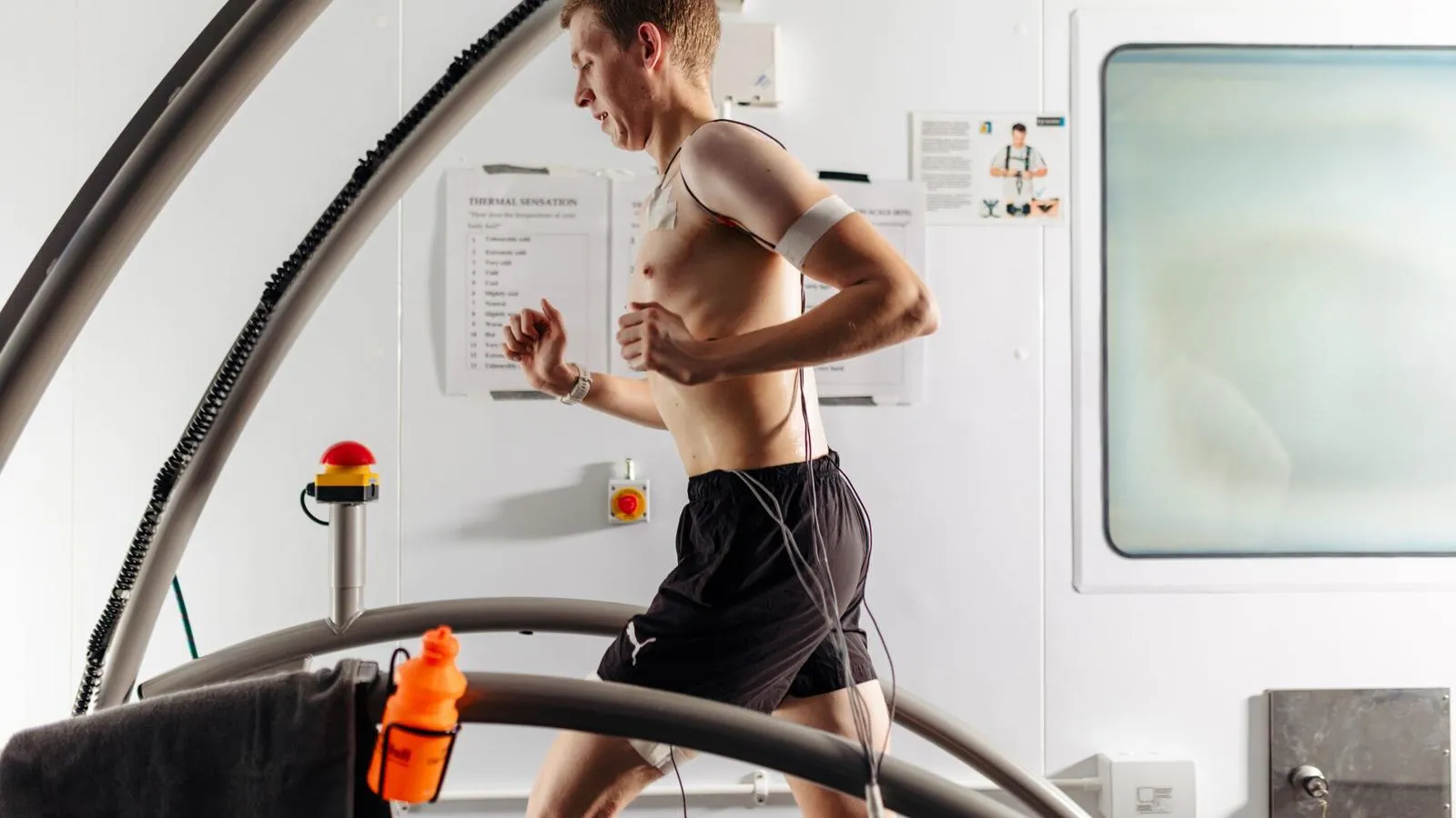 A man running a treadmill connected to wires