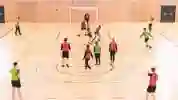 Football match in a sports hall