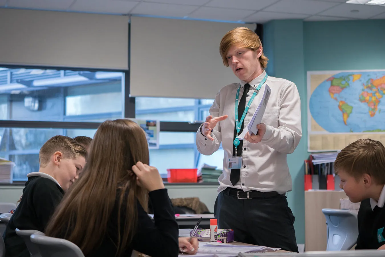 An Education Studies student stood at the front of a class talking to school pupils during a placement 