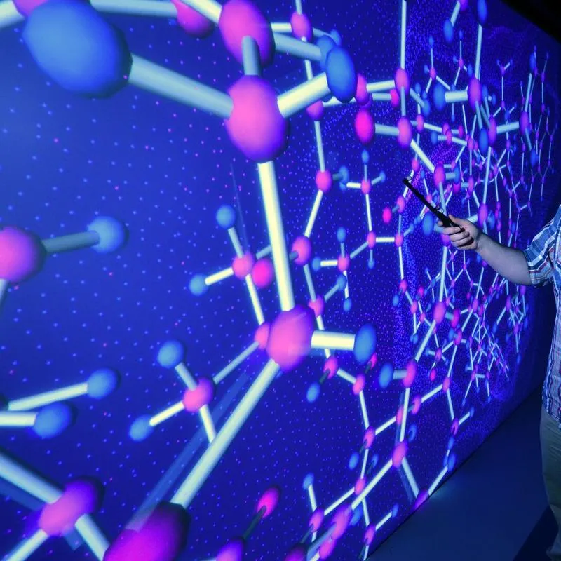 A student wearing a virtual reality headset working in the HIVE room