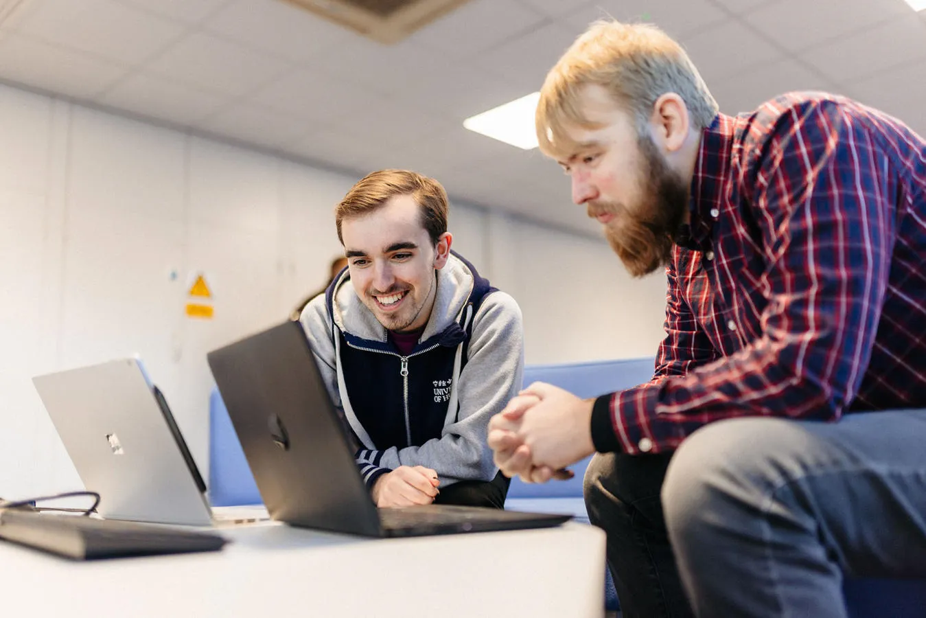 Students looking at laptops