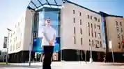 Student Midwife stood outside the Allam Medical Building