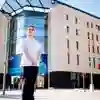 Student Midwife stood outside the Allam Medical Building