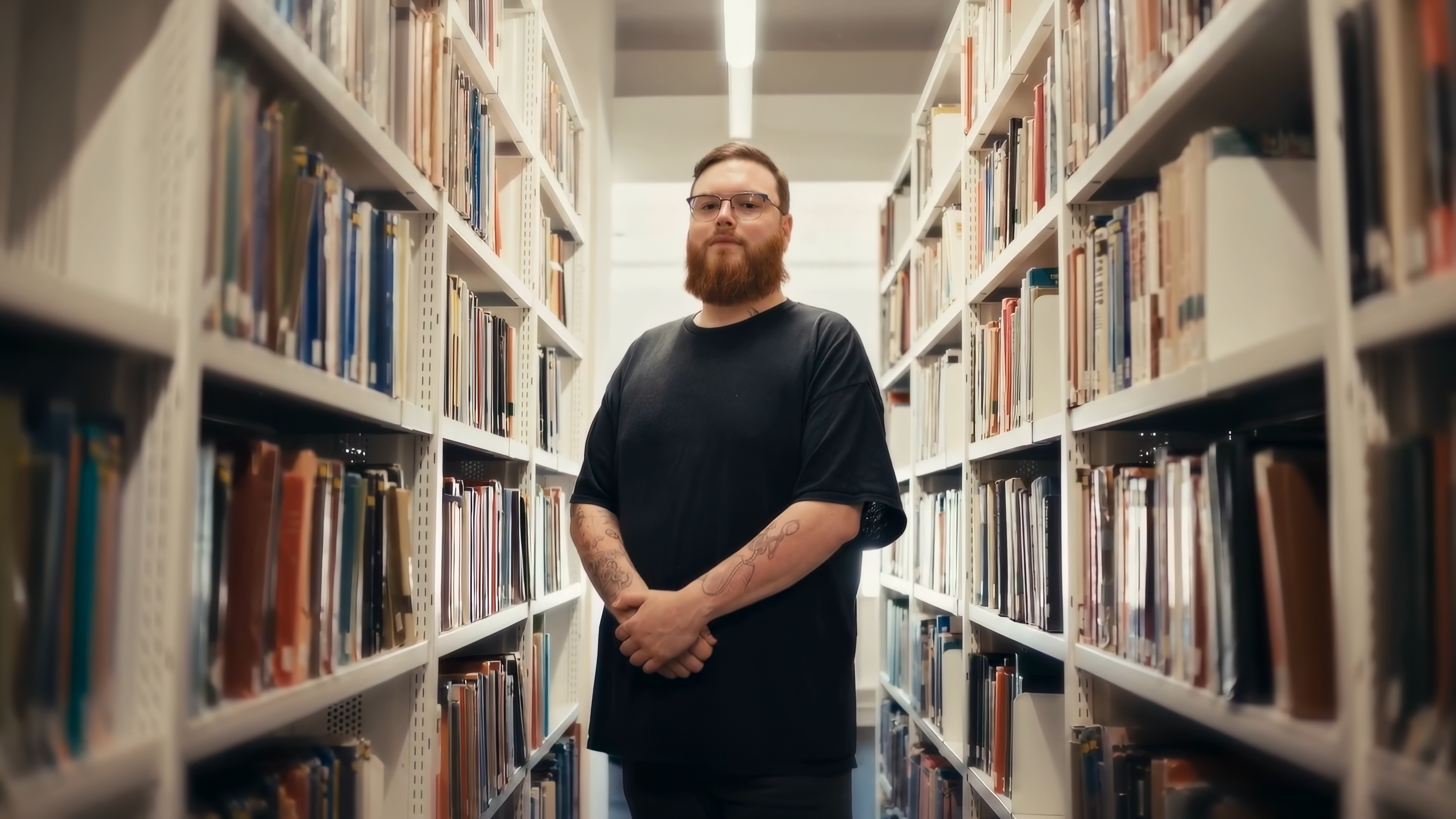 Foundation year student George standing in the University of Hull library