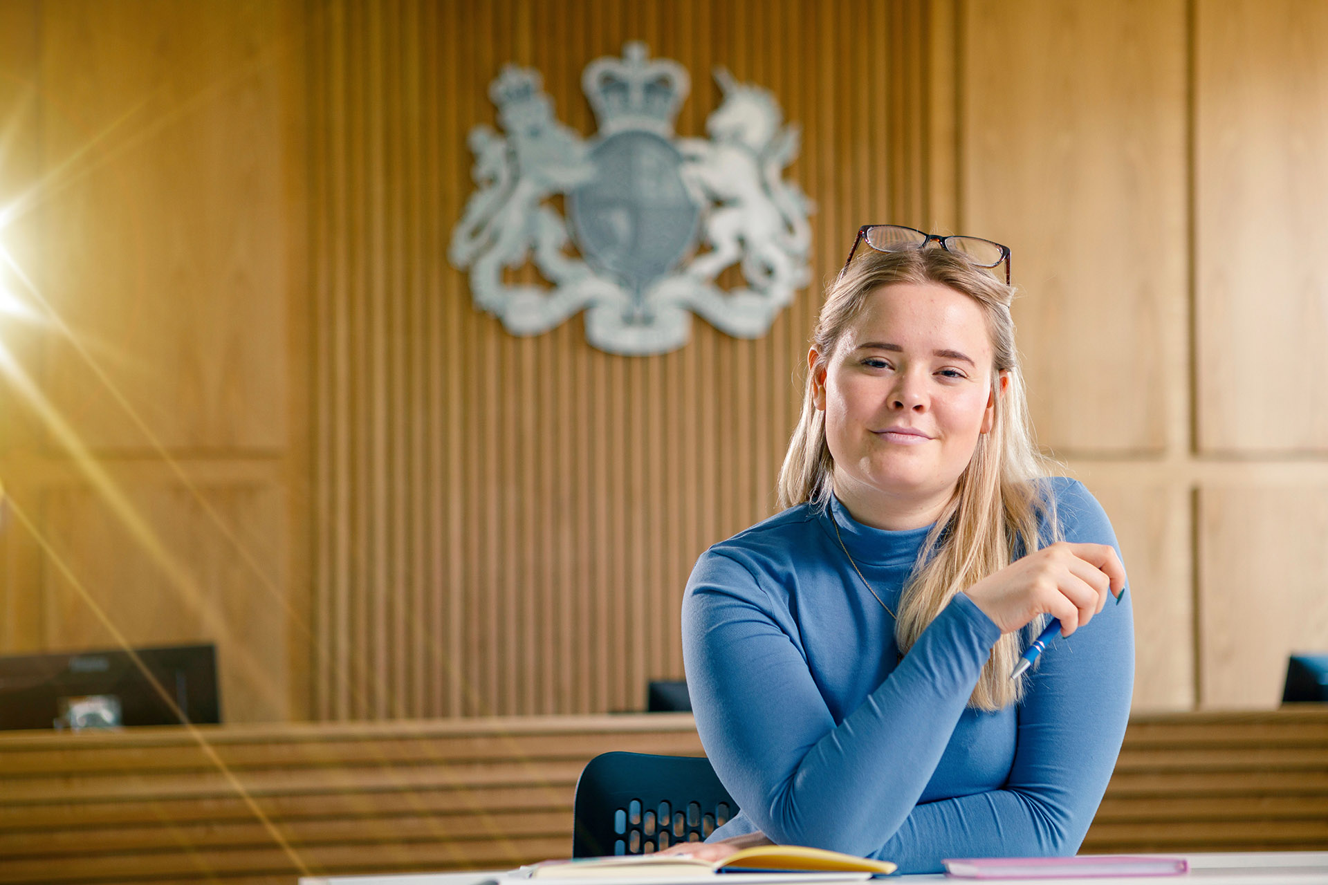 A law student sat in a mock courtroom