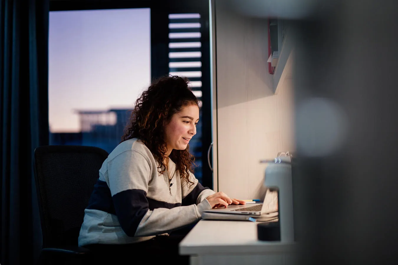 Student at desk on laptop 