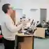 A lecturer speaking to a small room of people