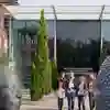 Three Business students walking out of the University's Business School
