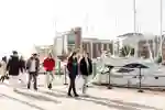 a group of students in the foreground with Hull Marina in the background