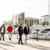 a group of students in the foreground with Hull Marina in the background