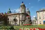 Hull Maritime Musuem in the sunshine with flowers in bloom in the foreground