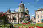 Hull Maritime Musuem in the sunshine with flowers in bloom in the foreground