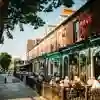 groups of drinkers sat outside bars in the sunsghine on Hull's trendy Princes Avenue