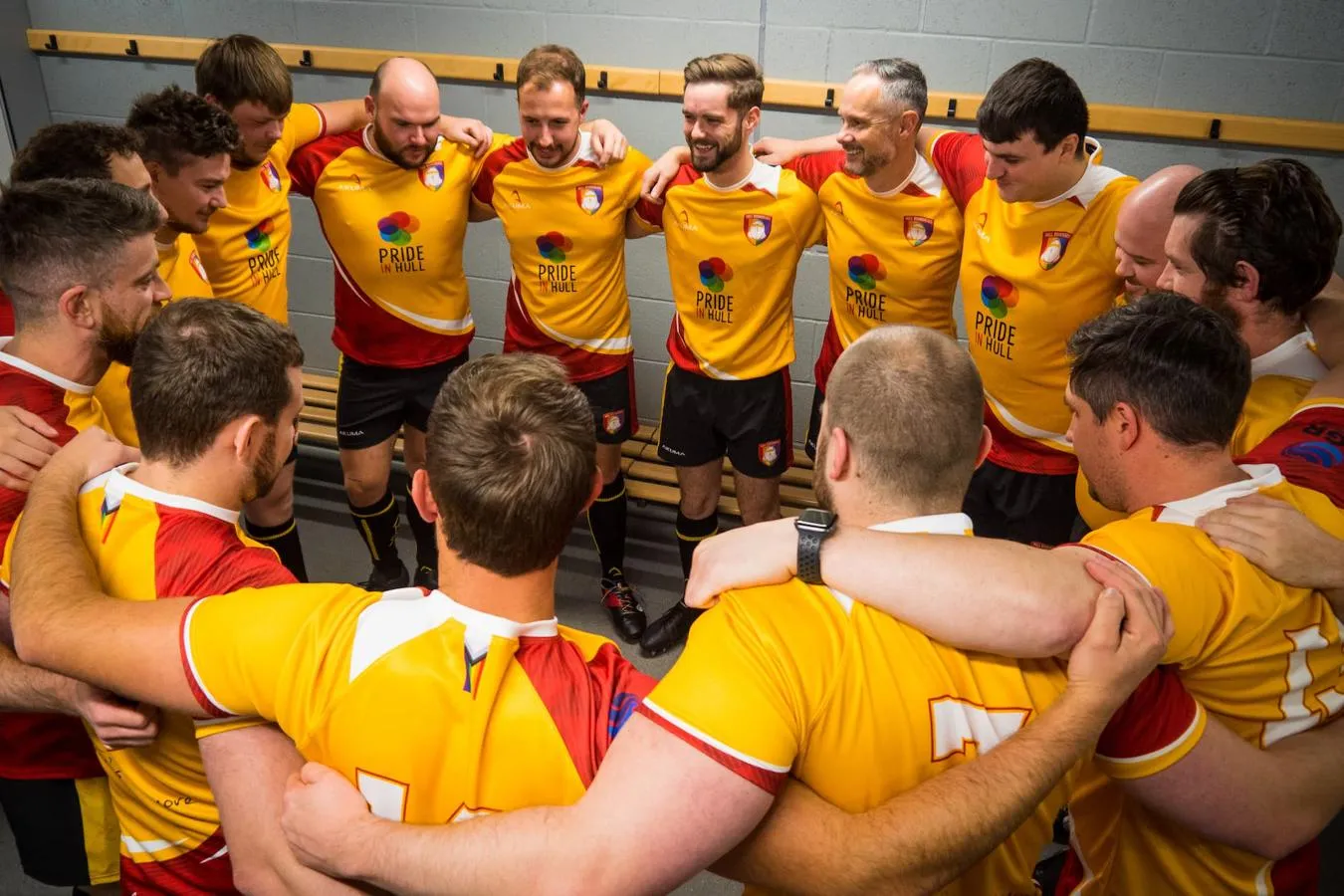 Hull Roundheads team, in yellow kit in a changing room