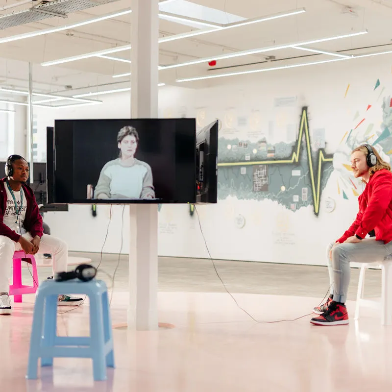 Two students in a media room