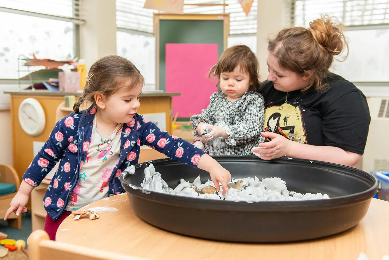 Two children with a teacher