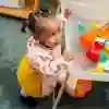 Young child playing with water toys in the Early Education Suite