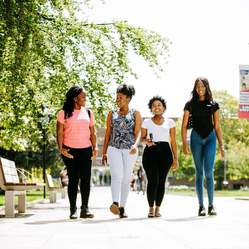 International students walking on campus.