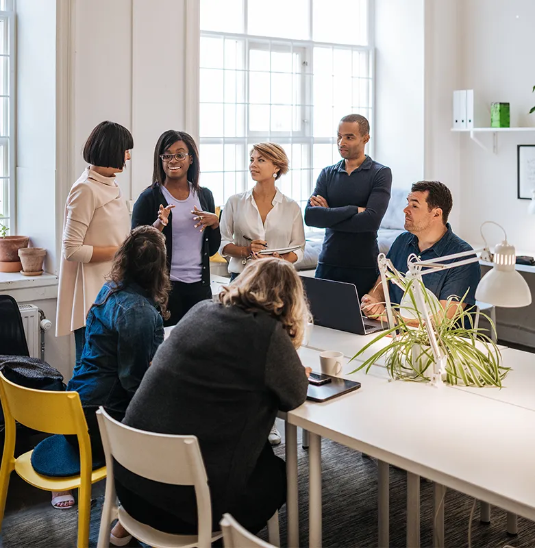 Group of health and social care staff with families and patients