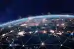 The globe from space with countries lit up and a network of lines over the top
