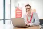 Graduate working on laptop