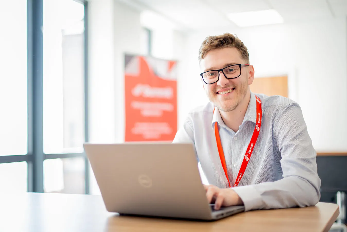 Graduate working on laptop