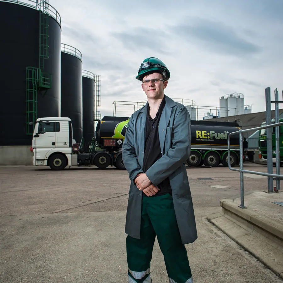 A Chemistry Intern wearing a hard hat at a factory