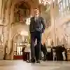A Hull student in a smart suit standing inside the Houses of Parliament while on placement in Westminster